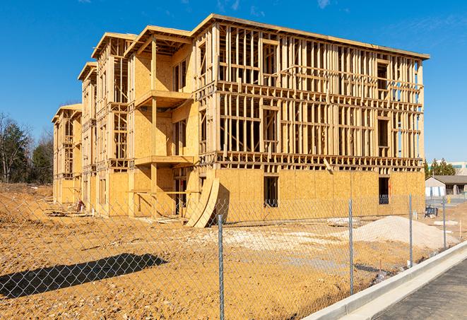 a job site enclosed by temporary chain link fences, ensuring safety for workers and pedestrians in Dysart, IA